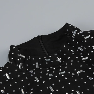 Macro detail of high neck mesh dress featuring silver rhinestones and a hidden zipper