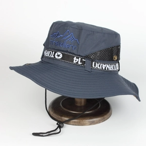 Detail of embroidered Travellero logo and mesh vents on camouflage bucket hat
