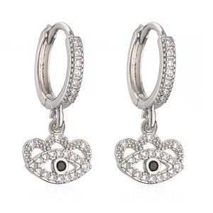 Silver evil eye drop earrings featuring white zircons and black center stone on white backdrop