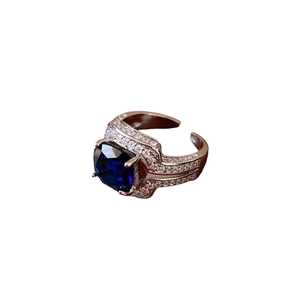 Adjustable silver ring with a deep blue square zircon and side diamond accents