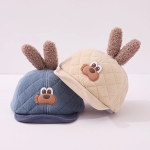 Detail of baby plush winter hat with cute rabbit ears and quilted warm fabric