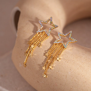 Elegant gold-plated star tassel earrings with zircons in a high-quality close-up shot