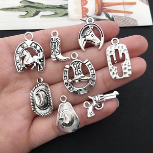 Eight western cowboy silver charms featuring boots, hats, and cacti for DIY jewelry making