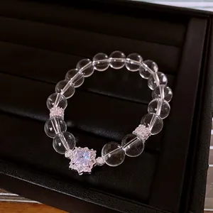 Clear crystal beaded bracelet with square centerpiece and sparkling diamond halo accents