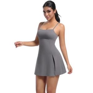Close-up of side slit on a dark gray athletic dress with thin straps and sleek cut