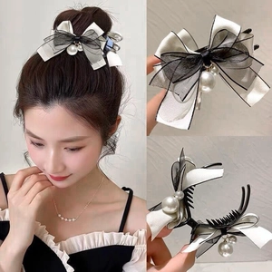 Elegant black and white mesh bow hair claw clip with faux pearl details for women