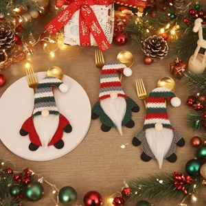 Christmas gnome cutlery holders in red green and grey on festive wooden table