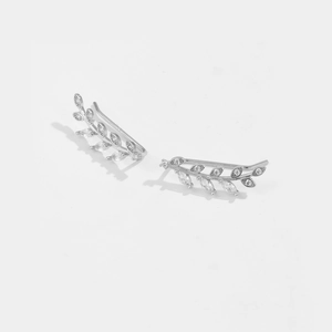 Detailed view of leaf-shaped ear crawler earrings with inlaid sparkling cubic zirconia