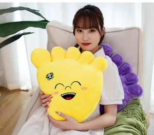 Macro detail of soft big foot plush pillow with cute smile and spider embroidery