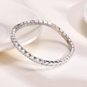 Close-up of sparkling zircon crystals set in a silver-plated titanium steel bracelet