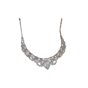 U-shaped rhinestone tassel necklace and earrings set with silver finish and crystal gems