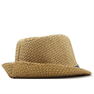 Detailed side view of tight weave texture and dark decorative ribbon on a straw hat