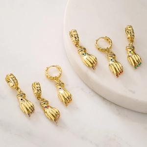 Gold plated hoop earrings with evil eye hand charms featuring colorful enamel accents