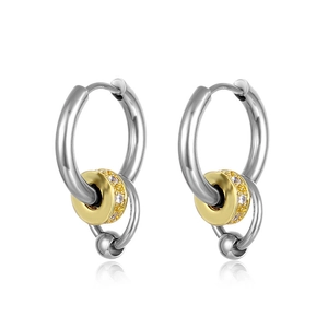 Close-up of silver and gold titanium hoop earrings with zircon stones and bead charms