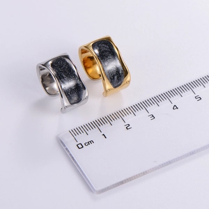 Gold and silver irregular textured ear cuffs with marble inlay and measuring scale