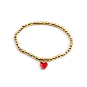 Minimalist gold beaded bracelet featuring a vibrant red heart pendant for women