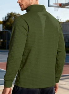 Macro view of olive green waffle knit texture on men's stand-up collar sweatshirt