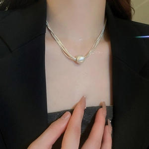 Minimalist multi-layer silver choker necklace with a central round white pearl bead