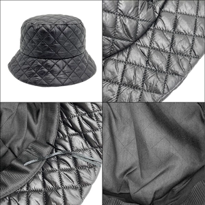 Detail view of black quilted puffer bucket hat showing interior drawstring and fabric texture
