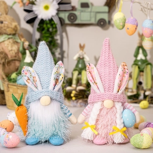 Detail of Easter gnomes featuring knitted hats with bunny ears and carrot accessories