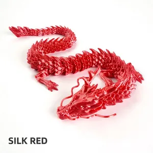 Detailed view of 3D printed articulated dragon model in silk red metallic finish