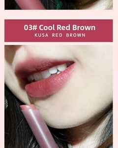 Macro shot of Kusa Red Brown matte lipstick on lips showing velvet texture finish