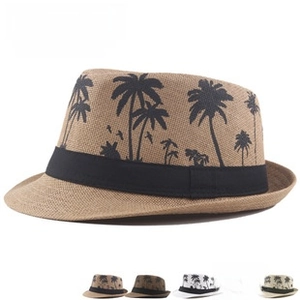 Detail view of woven paper fedora with tropical palm tree patterns and five color options