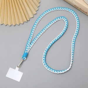 Detailed view of blue and white braided phone lanyard with secure metal clip and card