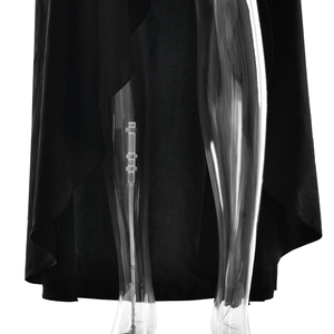 Detail view of the black satin dress featuring a high side slit and fluid hemline