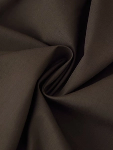Close-up of the pleated dark brown fabric texture showing fine weave and soft luster