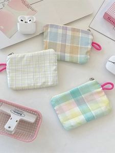 Three-piece set of plaid canvas coin purses with colorful floral prints and zippers