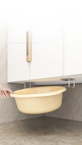 Close-up of stainless steel wall-mounted basin rack storage for bathroom organization
