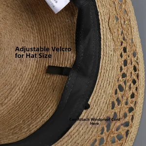 Detail view of straw hat interior with adjustable sweatband and wind rope loops