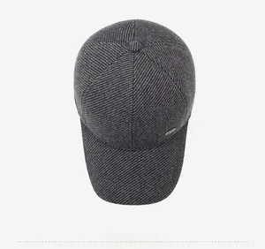 Top view of dark grey winter baseball cap showing thick twill fabric and button top