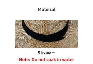 Detail of woven straw texture and black decorative ribbon on a summer beach sun hat