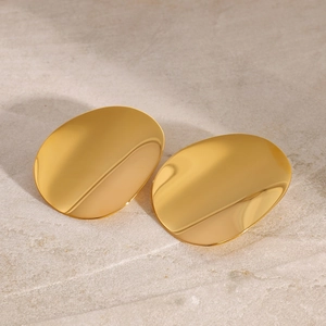 Polished gold stainless steel concave geometric earrings on stone background