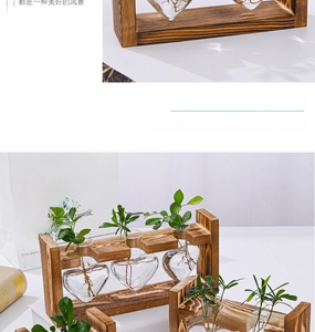 Detail of wooden stand with heart-shaped glass vases for hydroponic indoor plants