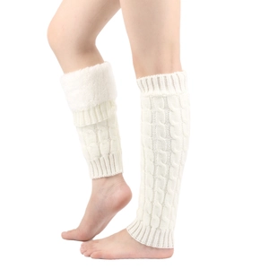 Detail of white cable knit leg warmers featuring soft fleece cuffs and braided texture