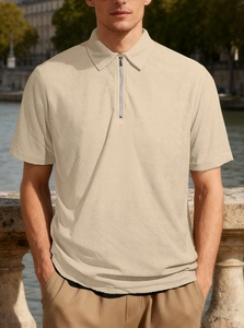 Detail of men's beige polo shirt with textured knit fabric and zip collar design