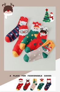 Detail of Christmas themed crew socks featuring Santa, reindeer, and snowflake patterns