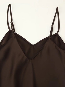 Detailed view of dark brown satin camisole featuring V-neck and adjustable thin straps
