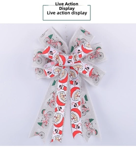 Detail of a double-layered Christmas bow with silver glitter and festive holiday prints
