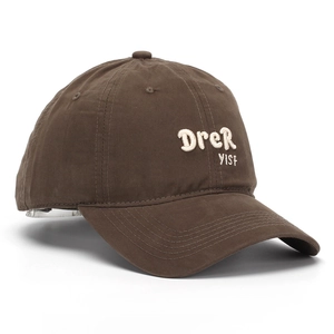 Close-up of deep brown cotton baseball cap with 3D embroidery and reinforced stitching
