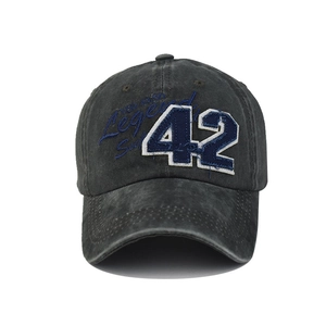 Detail of vintage grey washed cotton baseball cap with blue number 42 embroidery
