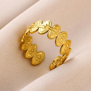 Detailed view of the 18k gold-plated open ring with a 3D heart-shaped geometric design