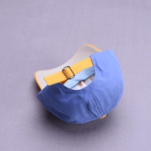 Blue and yellow kids dinosaur baseball cap with adjustable metal buckle and polka dot brim