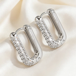 Detailed macro view of U-shaped rectangular earrings featuring pave-set cubic zirconia