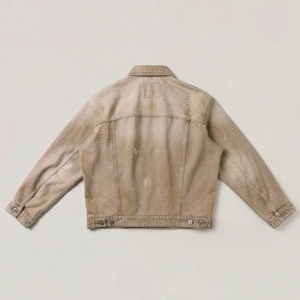 Macro shot of brown vintage oversized denim jacket back with distressed details