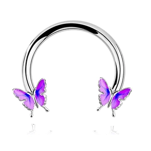 Macro shot of silver horseshoe nose ring with purple gradient butterfly ends