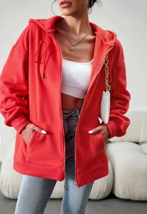 Detail of red zip-up fleece hoodie with soft texture and relaxed fit for women